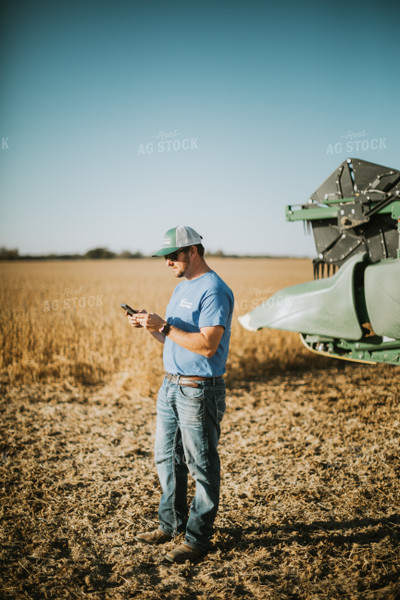 Farmer on Phone in Field 7135