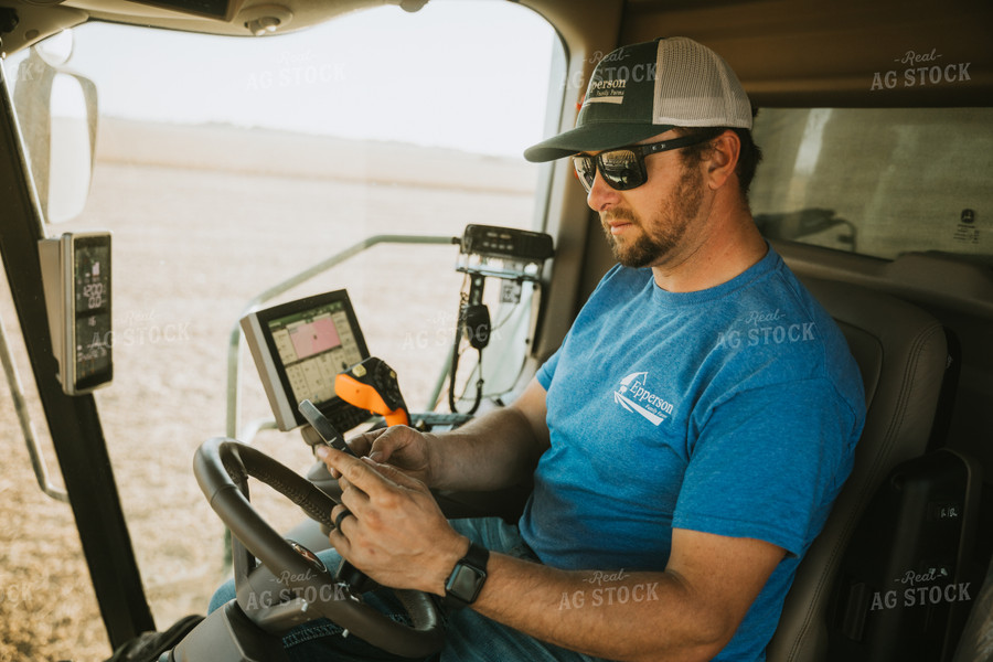 Farmer Inside of Combine on Phone 7207