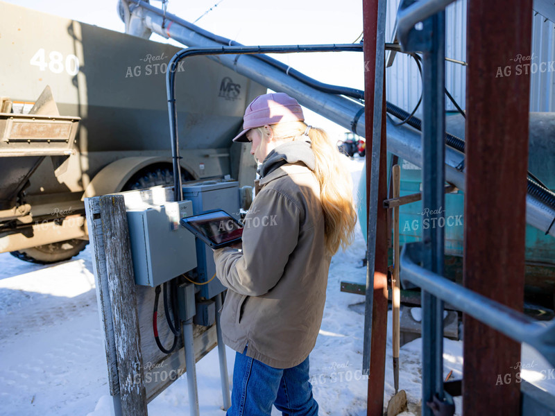 Rancher Looking at Tablet 70209