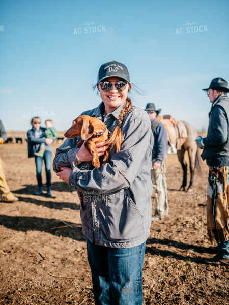 Farmer Holding Dog 56574