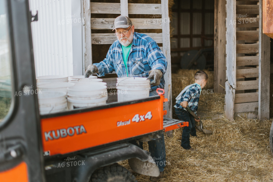 Farmer and Farm Kid Doing Chores 7396