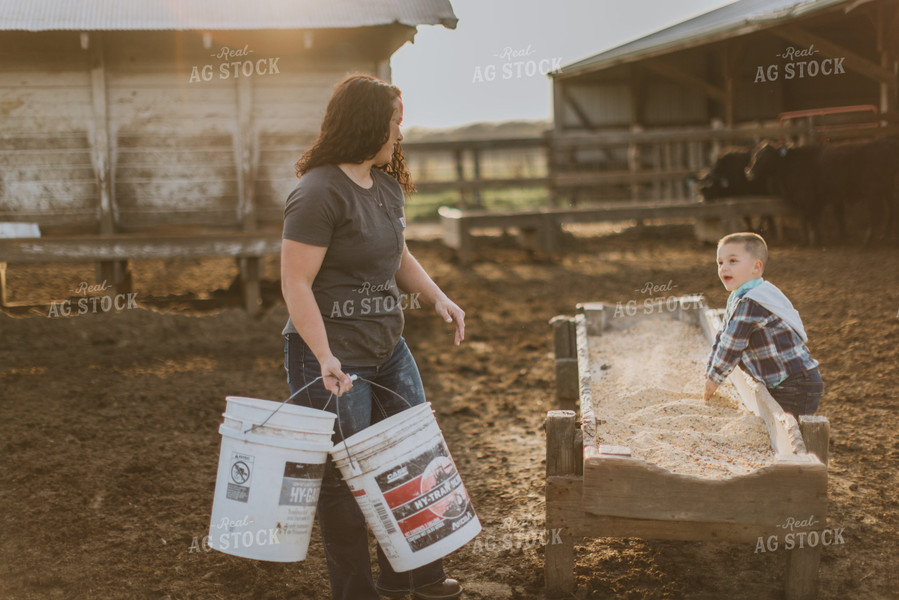 Farmer and Farm Kid Doing Chores 7408