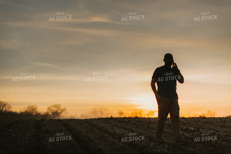 Farmer Talking on Phone in Field 7463