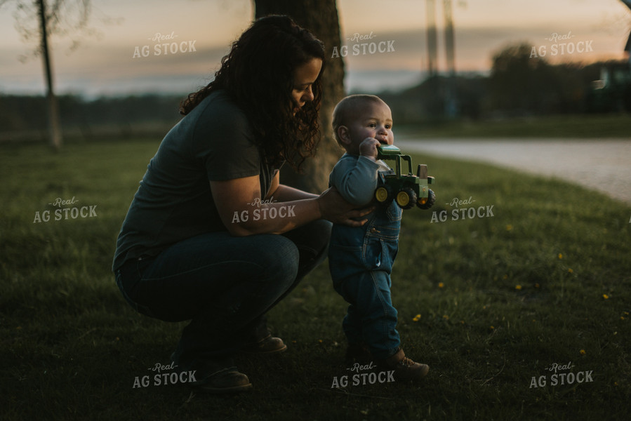 Farm Kid Playing with Toy Tractor 7475