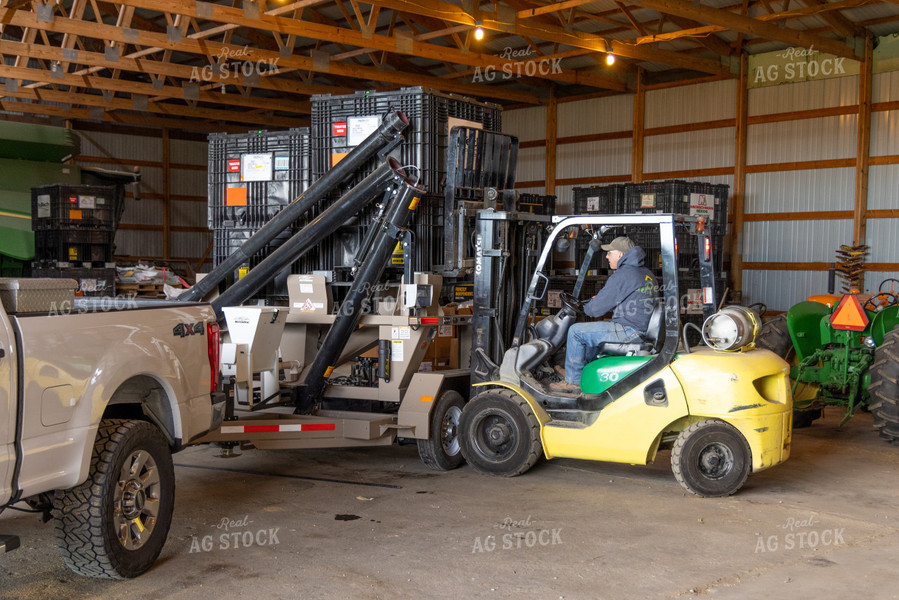 Farmer Operating Forklift 124015