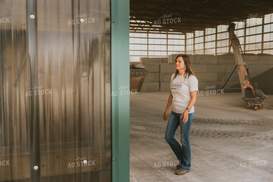 Woman Farmer Walks in Shed 7534