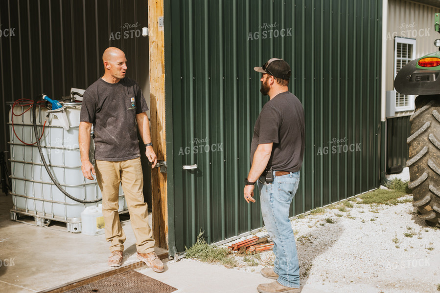 Farmers Talk Outside of Shed 7563