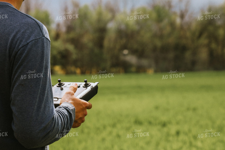 Close Up of Farmer's Hands Flying Drone 101045