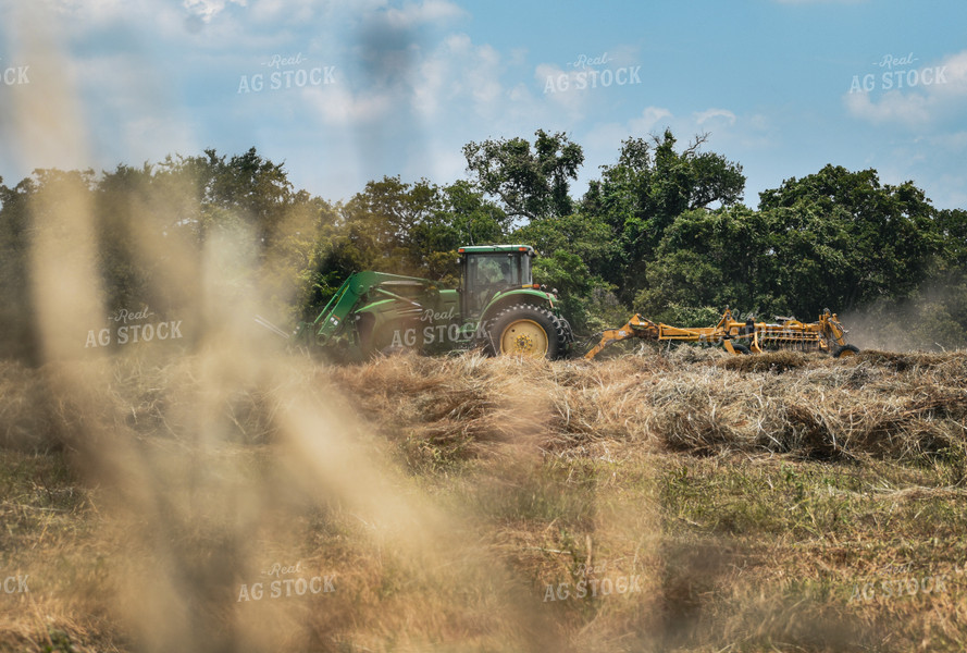 Front-End Loader Tractor Raking Hay 112015