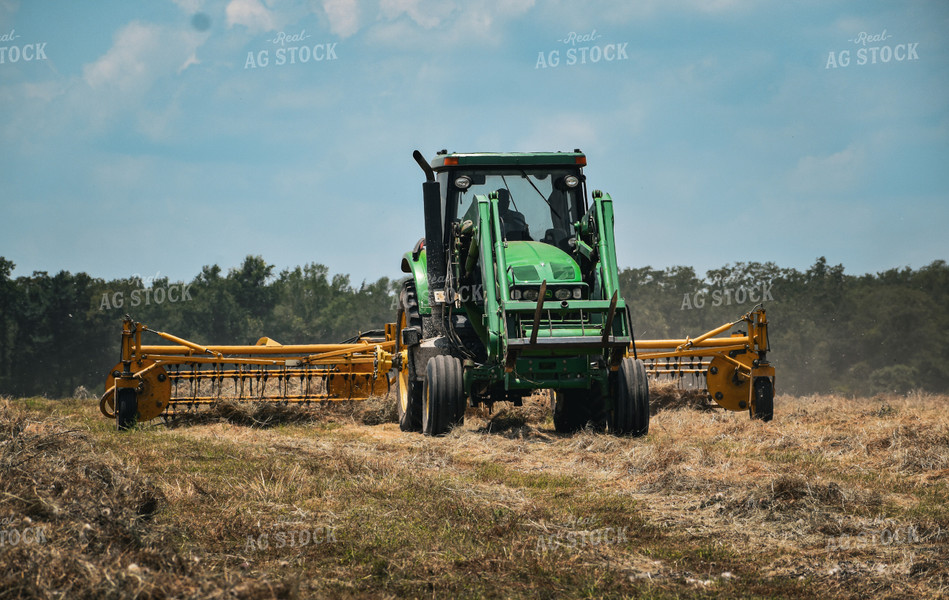 Front-End Loader Tractor Raking Hay 112018