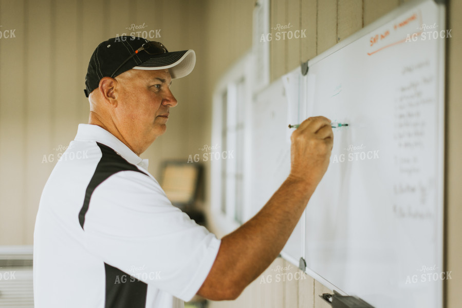 Farmer Writing on White Board 7755