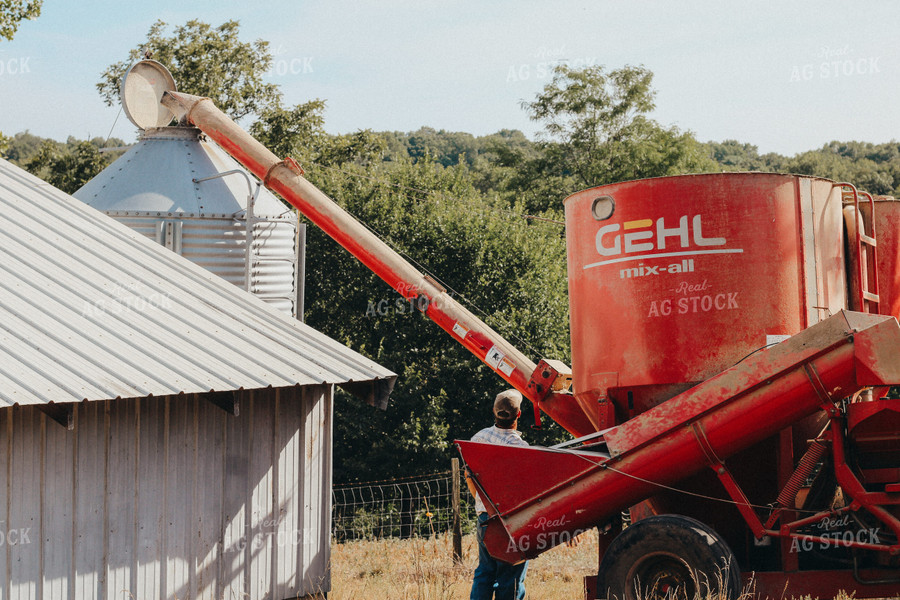 Farmer Loading Bottom Feed Hopper Bin 101050