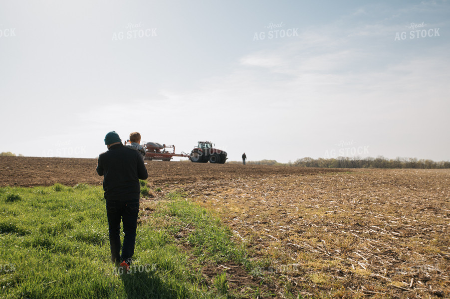 Farm Family in Field During Planting 26048