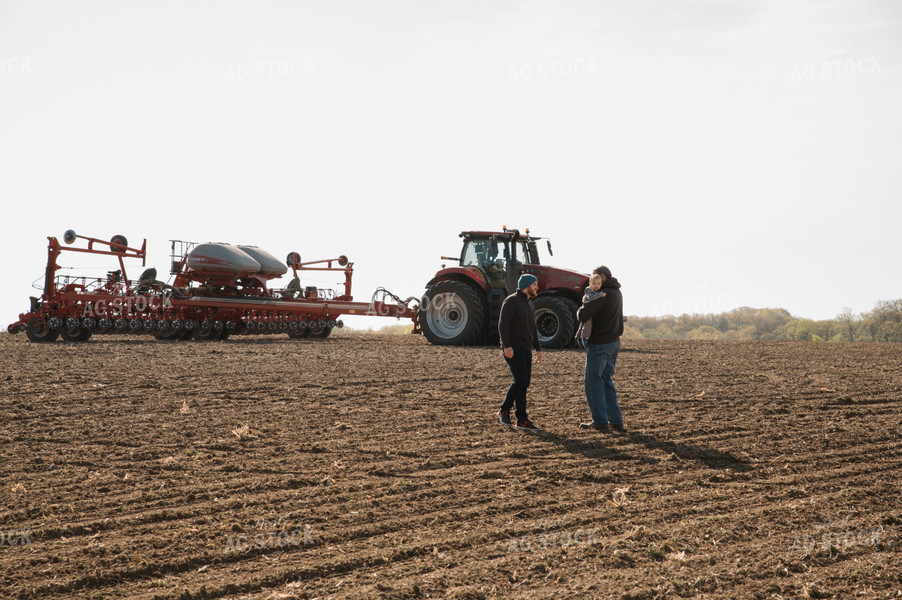 Farm Family in Field During Planting 26050