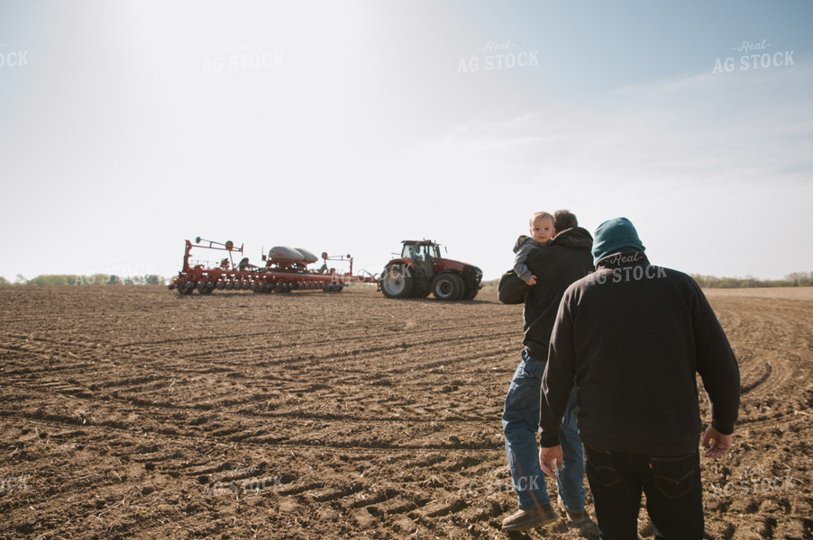 Farm Family in Field During Planting 26051