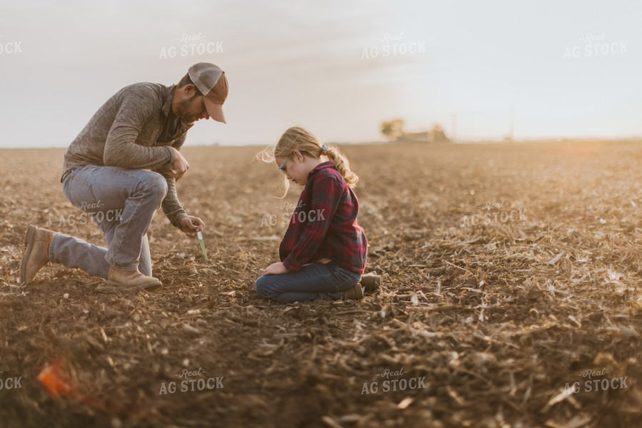 Farmer Checking Seed Depth with Daughter 8226