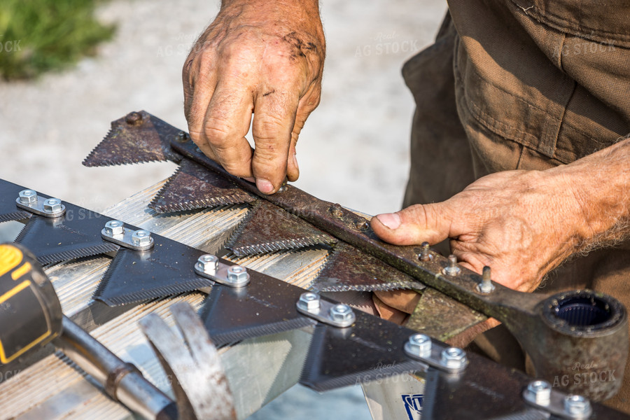 Farmer Fixing Swather 138092