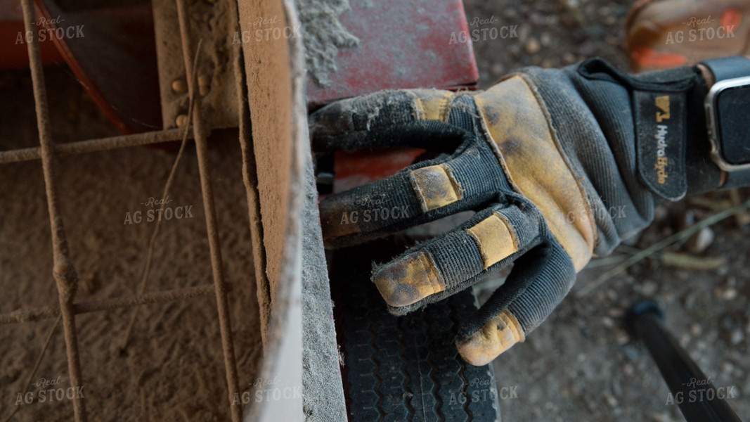 Farmer Fixing Sweep Auger 26098