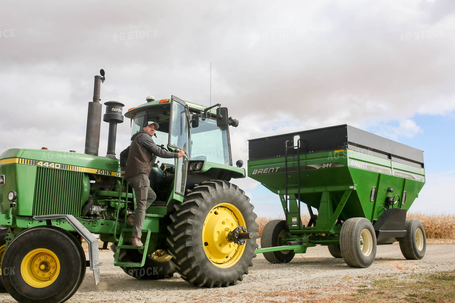 Farmer Climbing into Tractor 161062