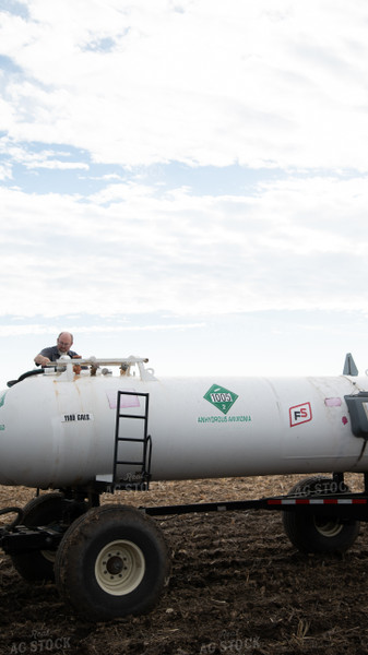 Farmer with Anhydrous Tanks 26147