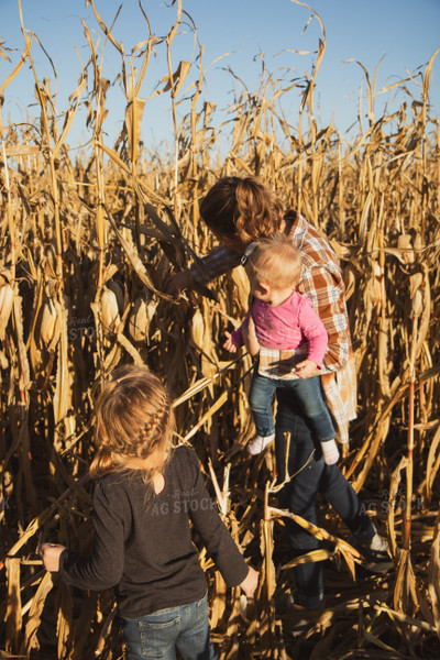 Female Farmer and Kids Checking Corn 67546