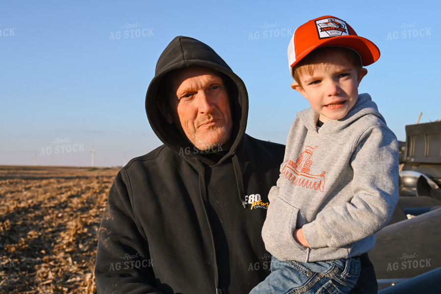 Farmer Holding Kid 26325