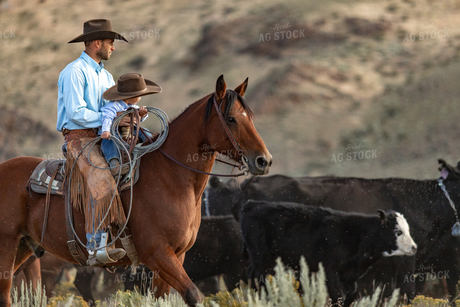 Rancher and Ranch Kid on Horseback 188047
