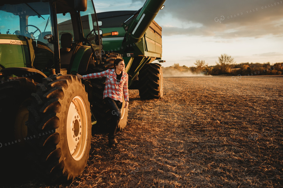 Female Farmer Climbing out of Tractor 3467