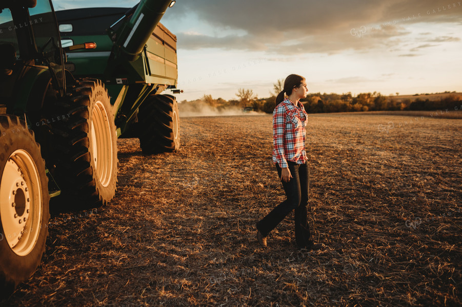 Female Farmer Climbing out of Tractor 3468