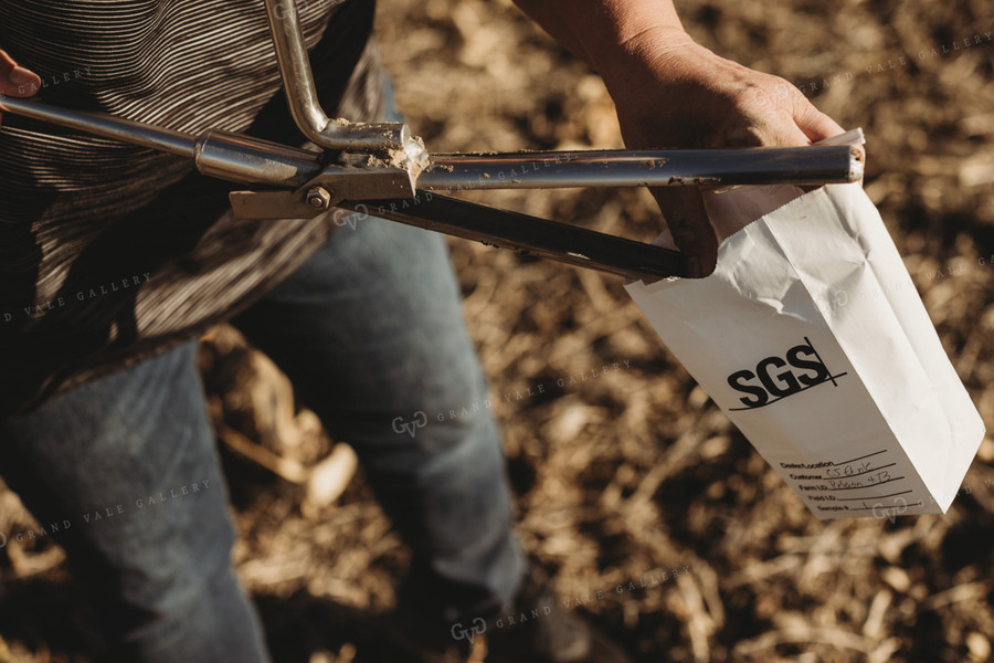 Farmer Opening Soil Sampling Probe with Soil Core 3714