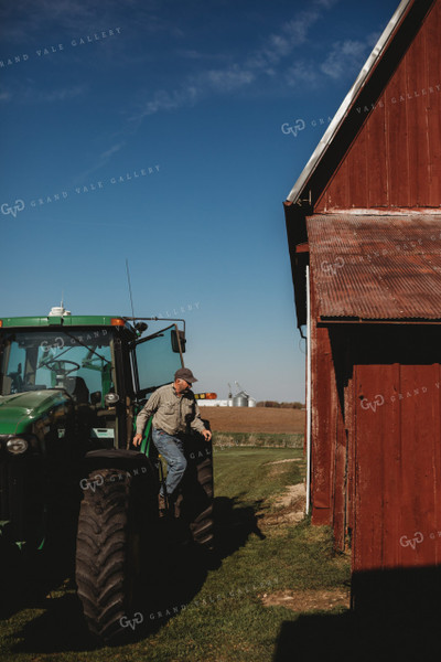 Farmer Climbing out of Tractor Red Barn 4085
