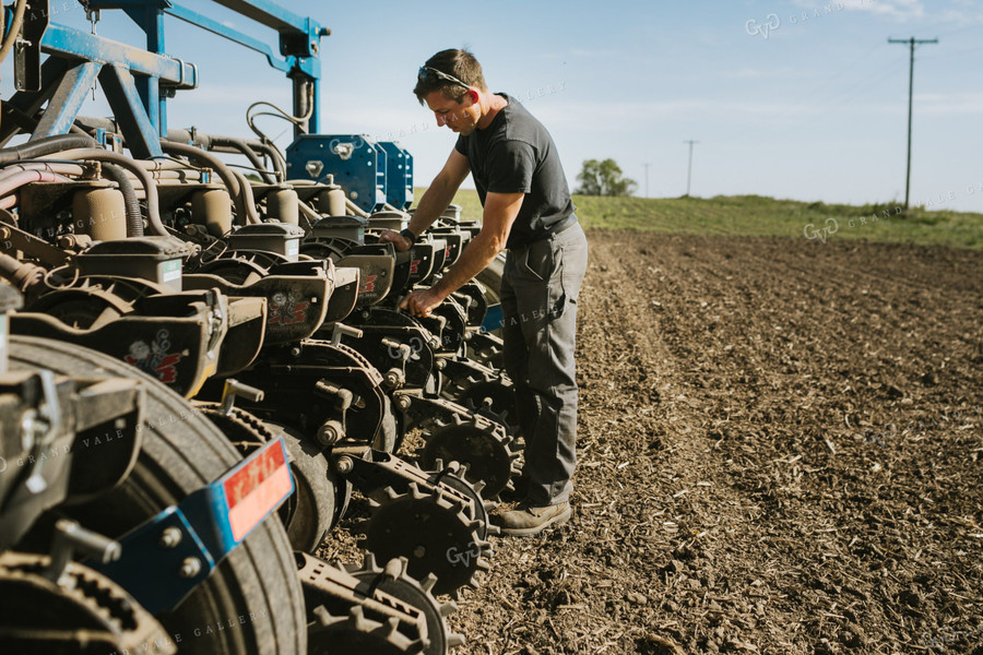 Farmer Adjusting Planter 4129