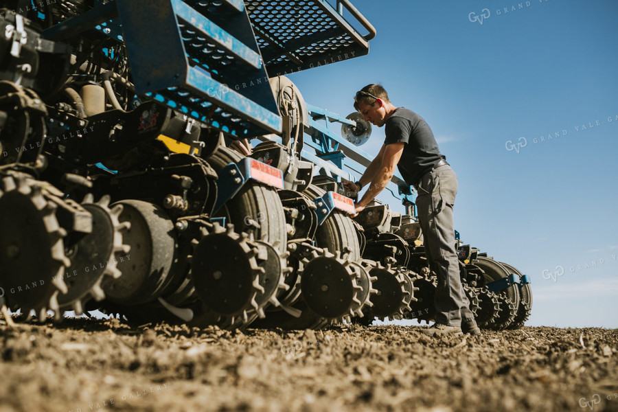 Farmer Adjusting Planter 4130