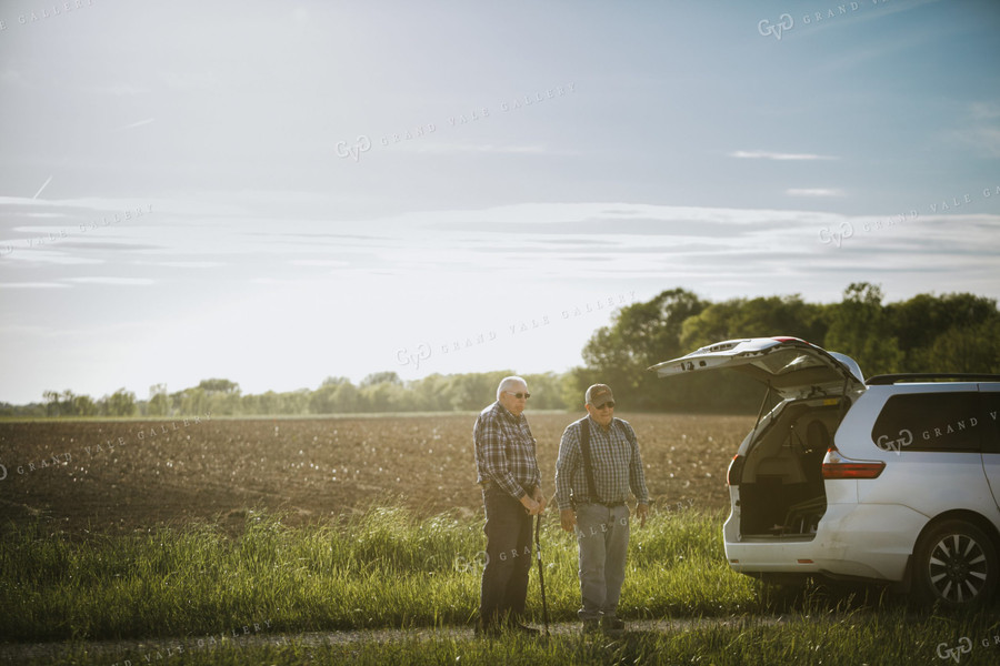 Farmer and Grandpa Standing Next to Field 4209