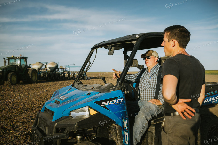 Farmers in Field with UTV and Tractor Planter 4258