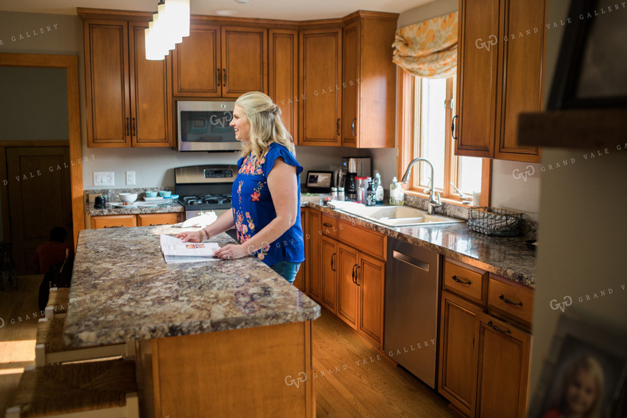 Farm Wife Flipping through Cookbook 4438