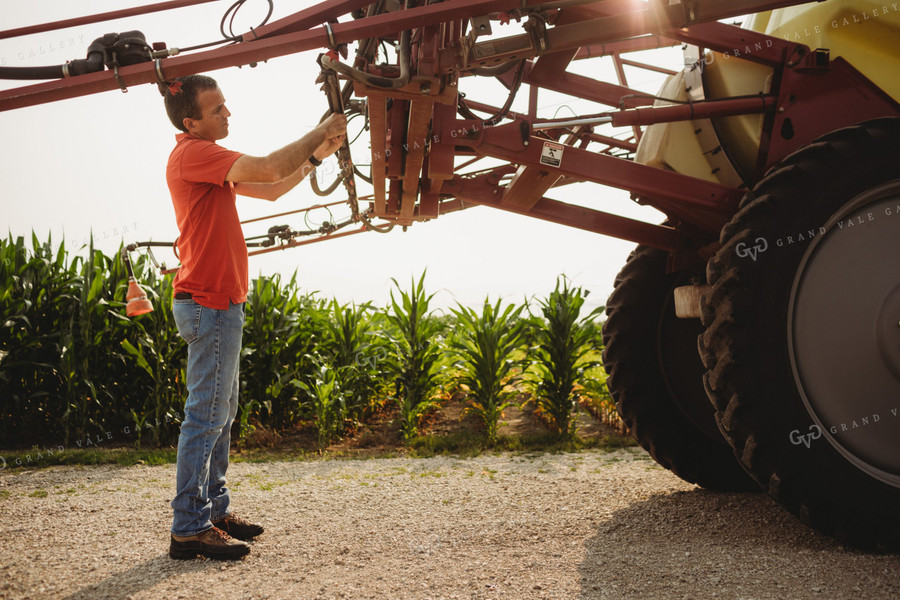 Farmer Checking Sprayer Nozzles 4448