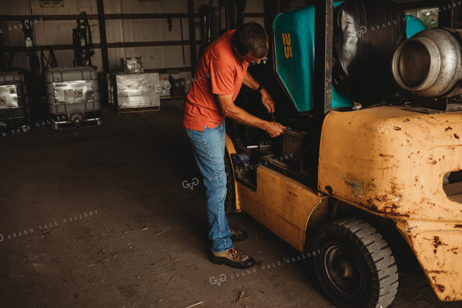 Farmer Working on Equipment 4516