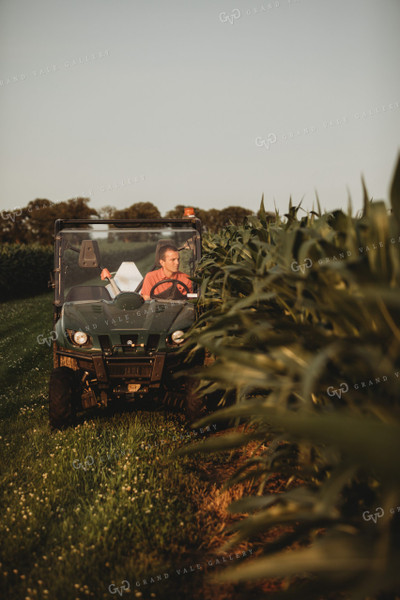 Farmer Checking Corn Crop in UTV 4555