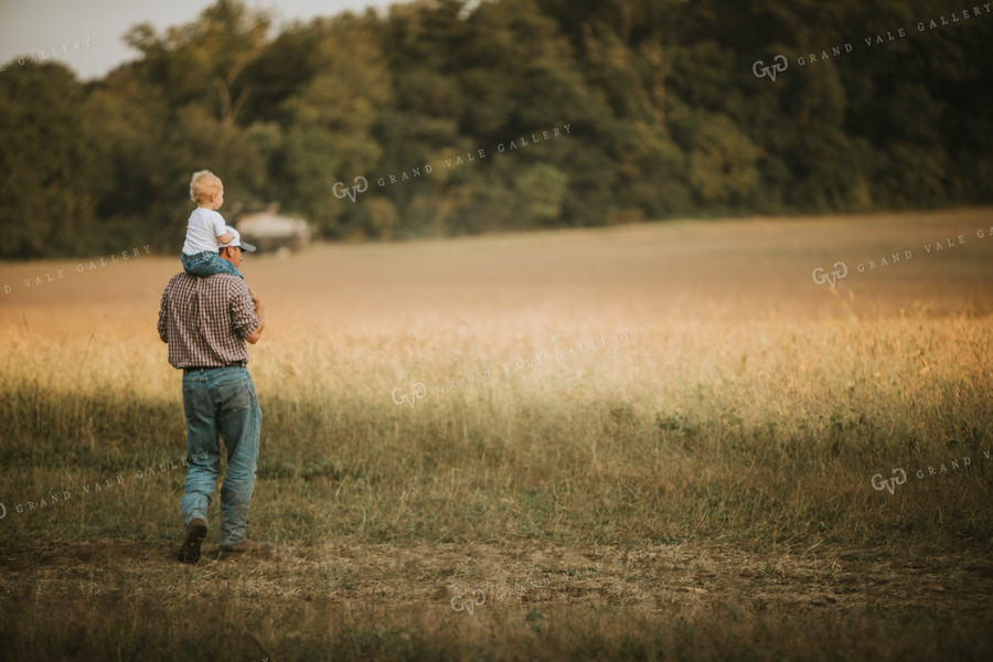 Farmer with Toddler on Shoulders 4811