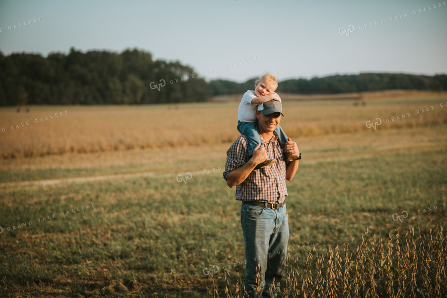 Farmer with Toddler on Shoulders 4812