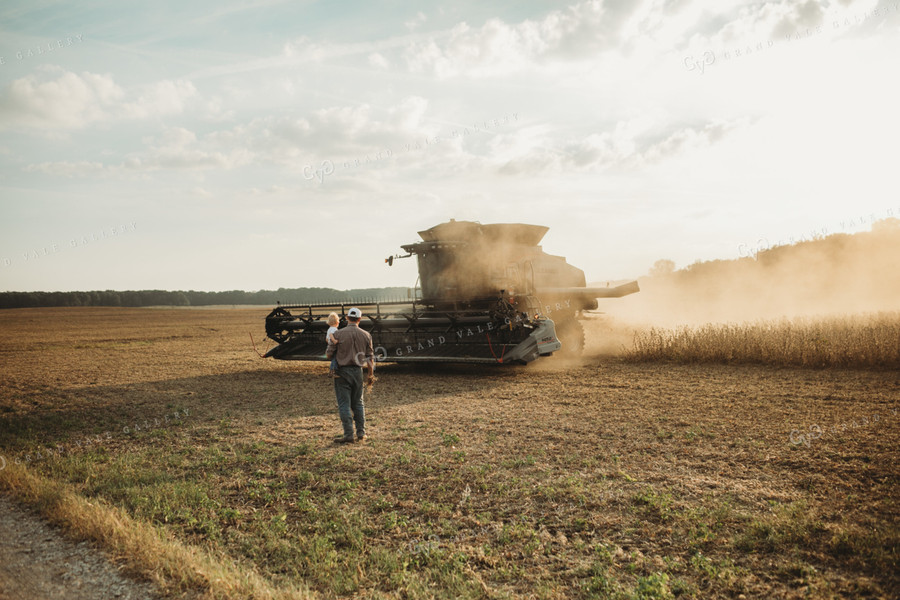 Farmer and Farm Kid Getting into Combine 4828