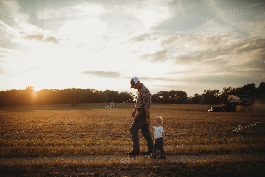 Farmer and Farm Kid Walking to Truck 4870