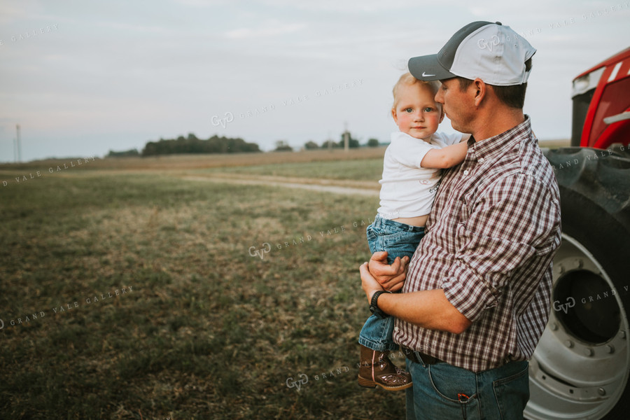 Farmer with Farm Kid Next to Tractor 4985