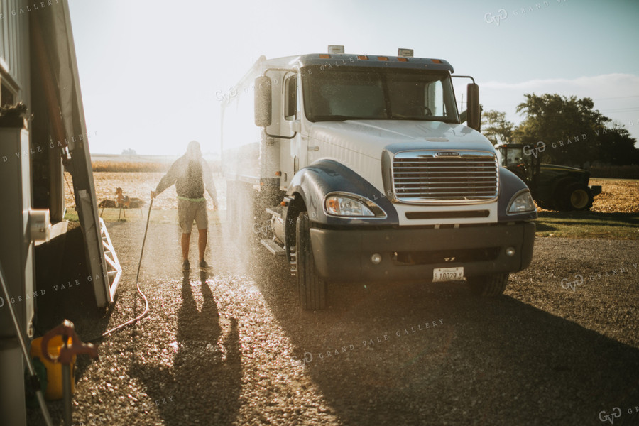 Farmer Hosing off Tandem Farm Truck 4667