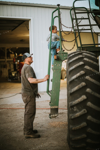 Farmer and Farm Kid Working on Combine 5122