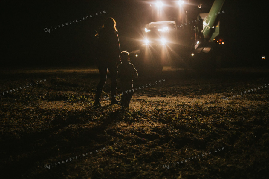 Farm Mom and Son Waiting for Tractor in Field at Night 5161
