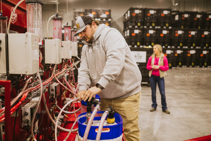 Man Hooking Up Seed Treatment Chemical 5328