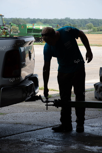 Farmer Hooking Up Hayrack 50142