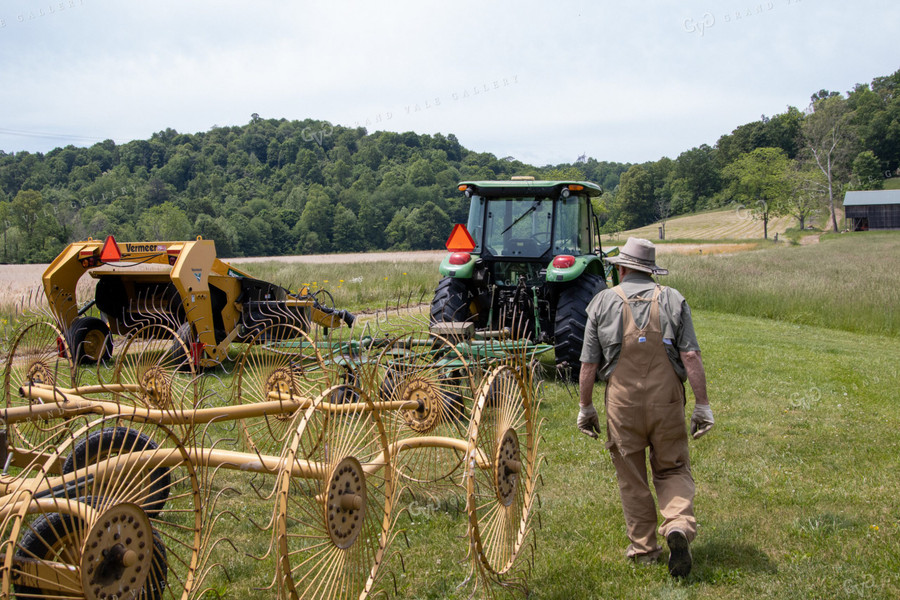 Farmer on Tractor with Hay Rake 52158